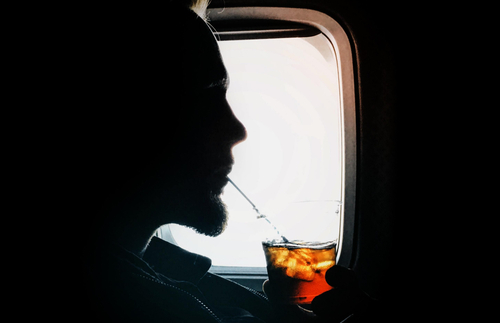 You’re Not Going to Like What Drinking Alcohol on Flights Does to Your Body, Per New Research | Frommer's