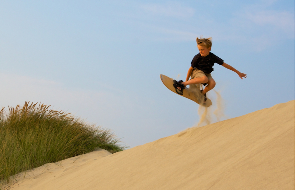 Oregon Coast road trip route plan: Sandboarding at the Oregon Dunes National Recreation Area